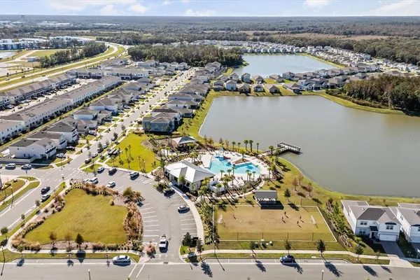an aerial view of residential houses with outdoor space