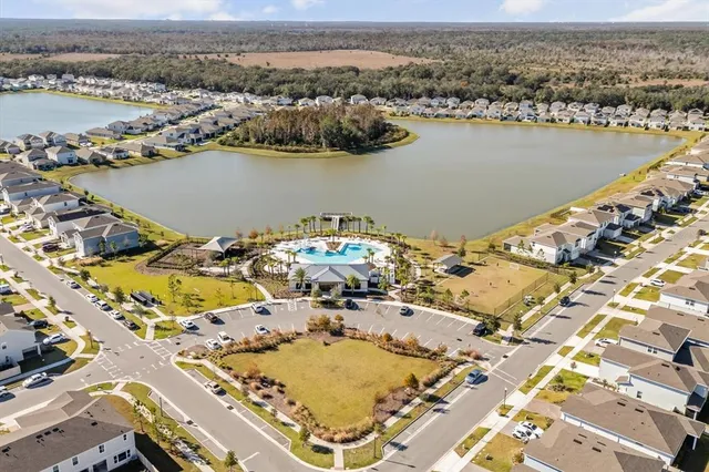 an aerial view of a house with outdoor space