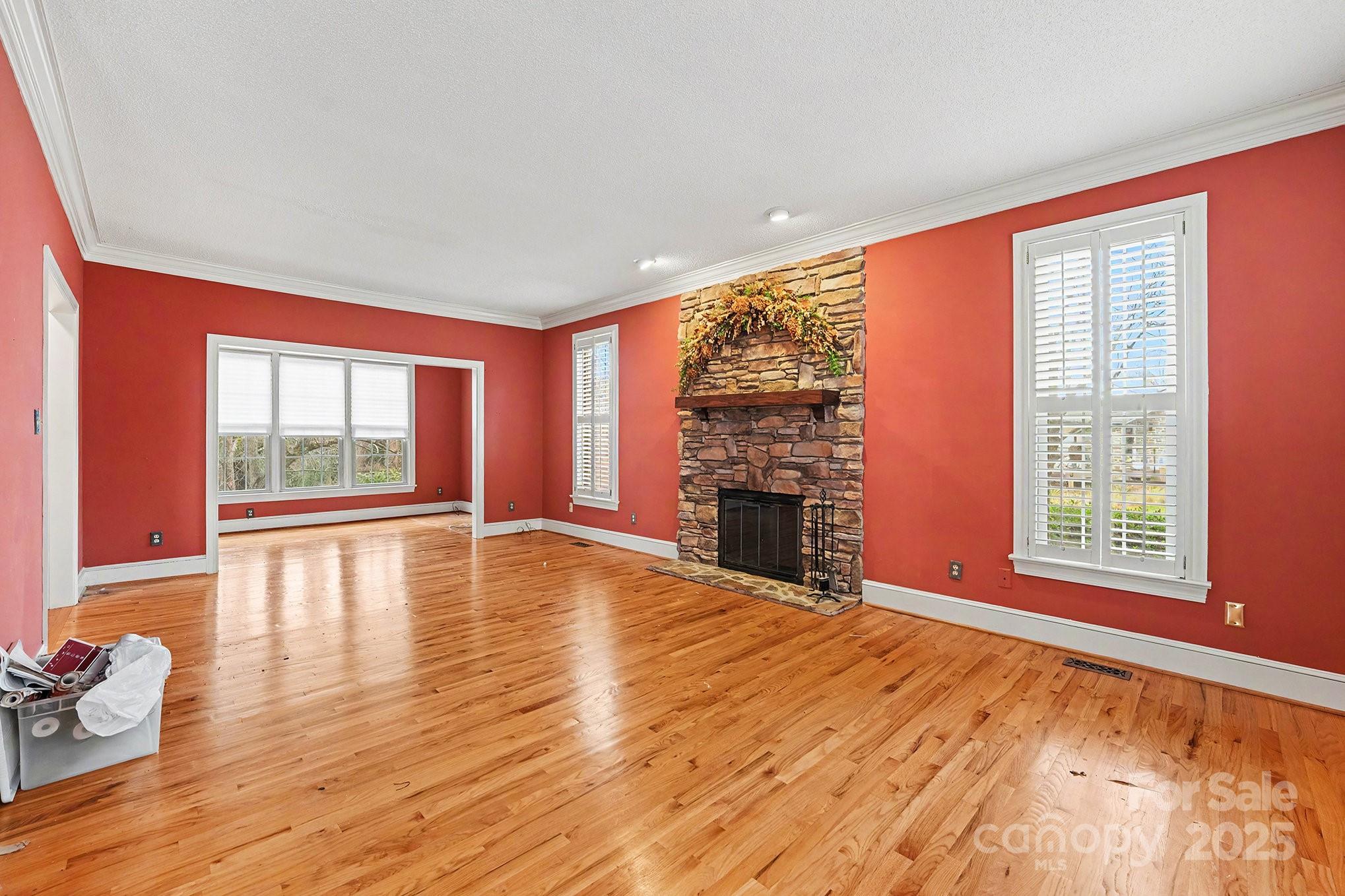 217 Nottingham Drive Huntersville, NC 28078 - Photo 13 of 41 wooden floor in an empty room with a window