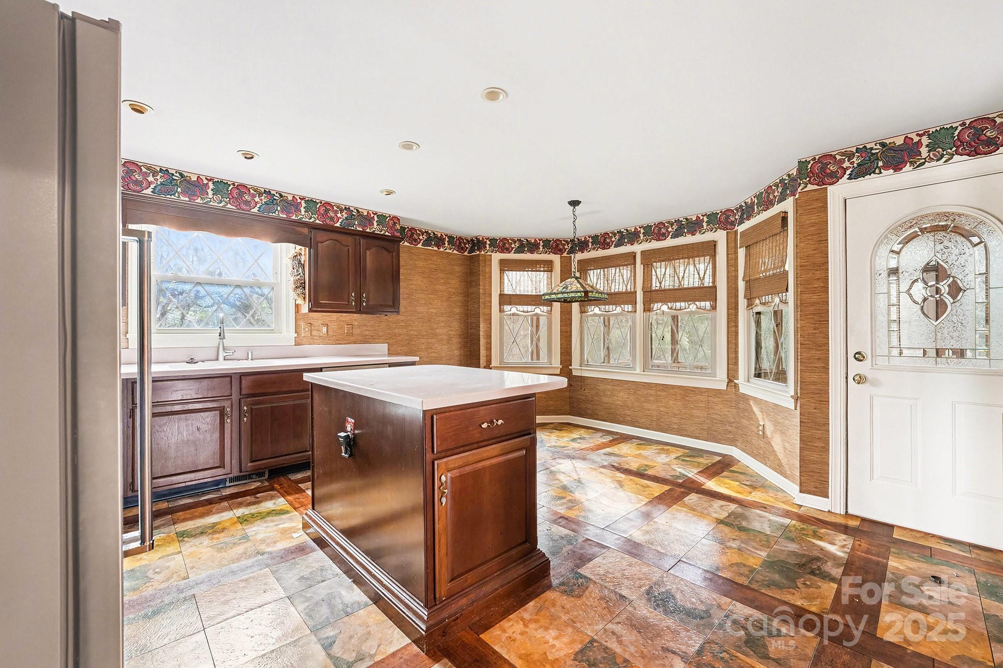 217 Nottingham Drive Huntersville, NC 28078 - Photo 17 of 41 a kitchen with a stove a sink and a refrigerator
