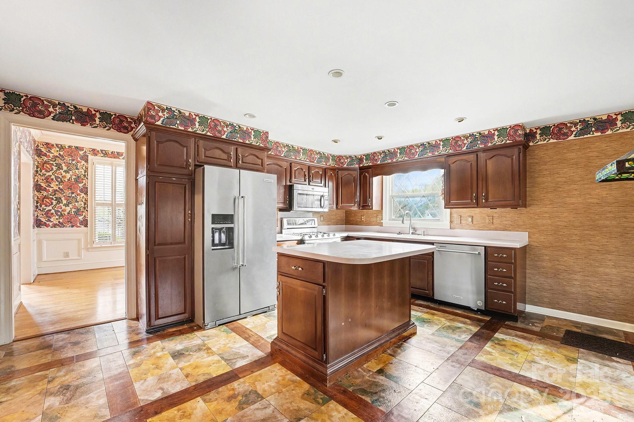 217 Nottingham Drive Huntersville, NC 28078 - Photo 19 of 41 a kitchen with a stove a refrigerator and cabinets