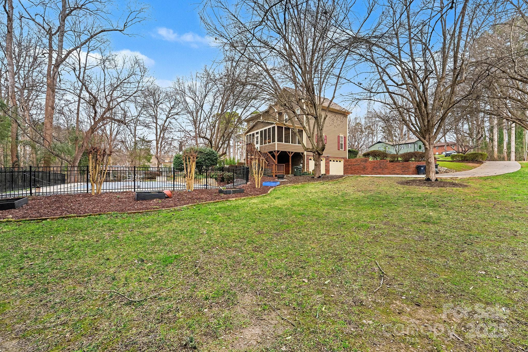 217 Nottingham Drive Huntersville, NC 28078 - Photo 2 of 41 a view of a park with large trees