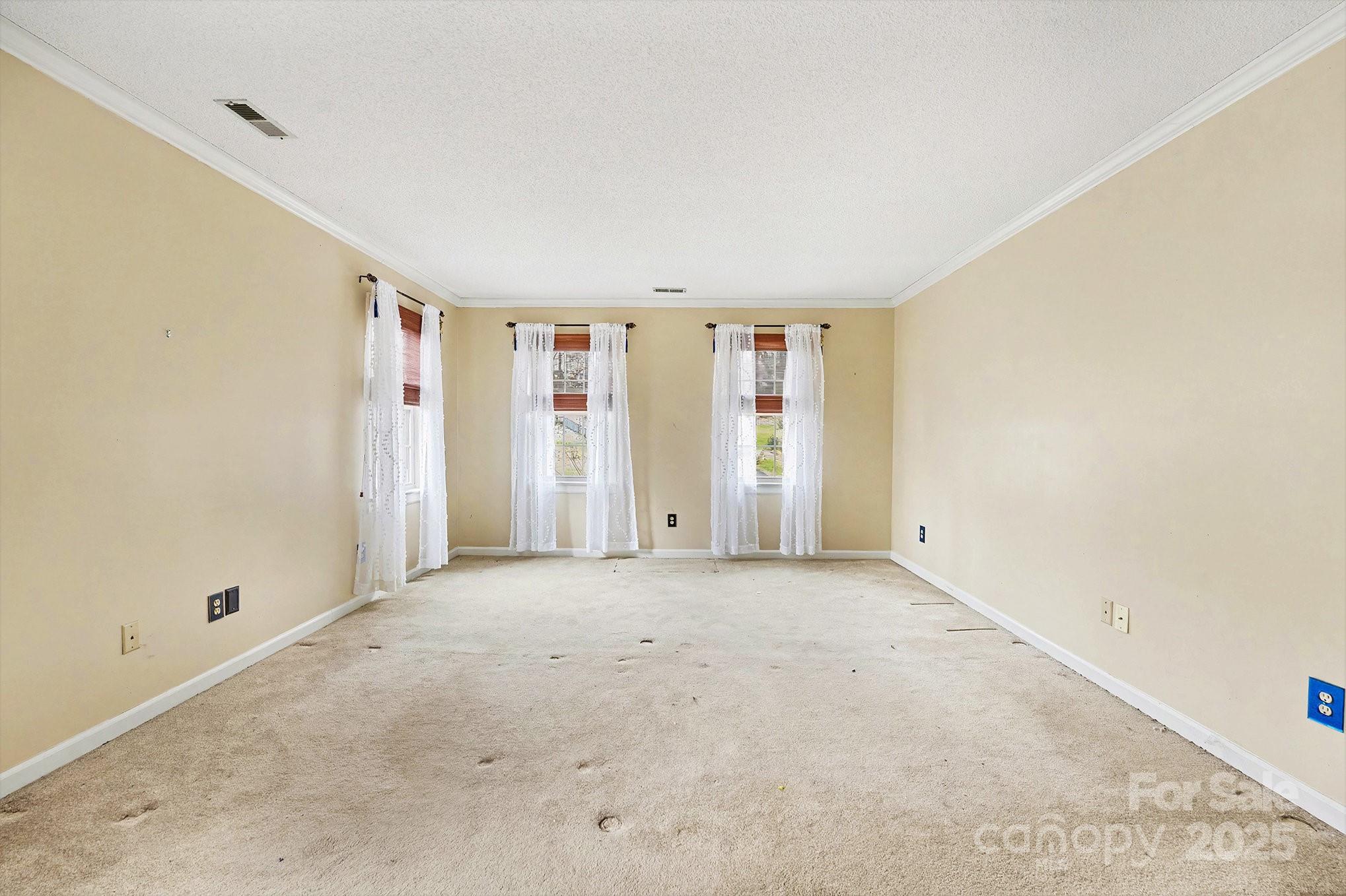 217 Nottingham Drive Huntersville, NC 28078 - Photo 23 of 41 an empty room with windows
