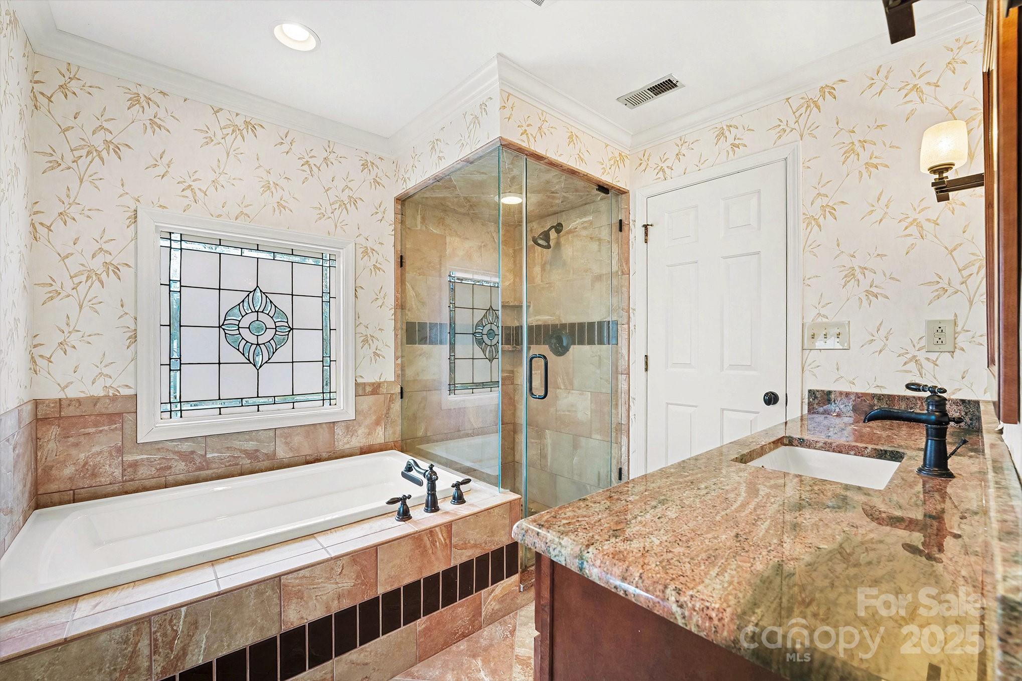 217 Nottingham Drive Huntersville, NC 28078 - Photo 26 of 41 a spacious bathroom with a granite countertop tub sink and mirror