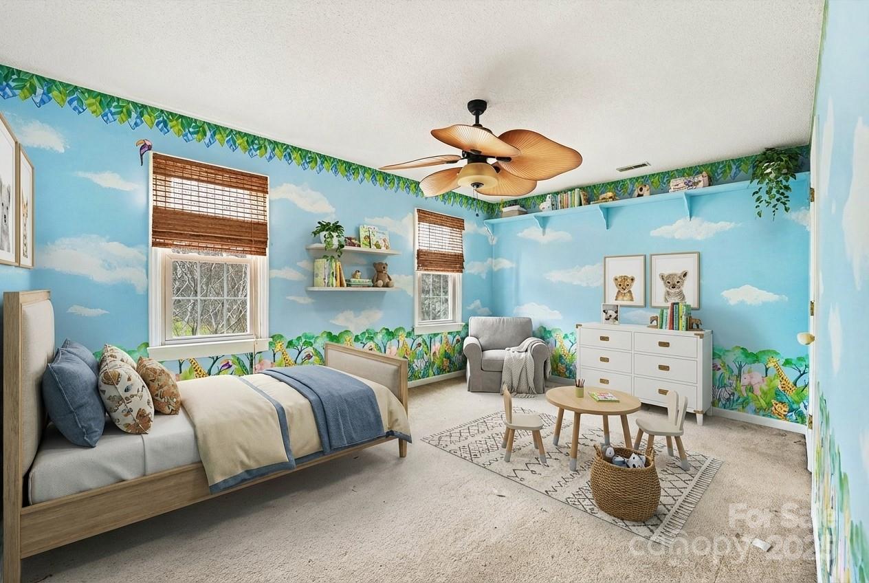 217 Nottingham Drive Huntersville, NC 28078 - Photo 6 of 41 a bedroom with furniture and a large window