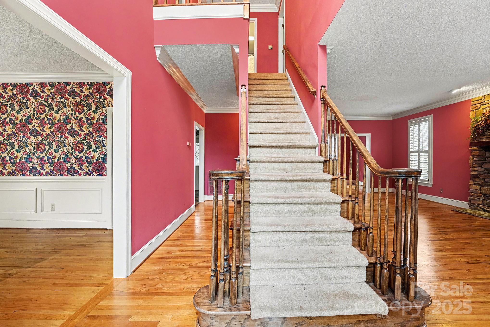 217 Nottingham Drive Huntersville, NC 28078 - Photo 9 of 41 a view of staircase with white walls and railing