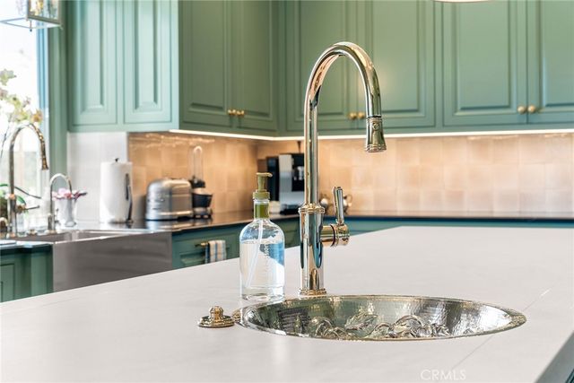 a bathroom with a sink vanity and a mirror