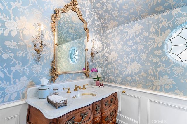a kitchen with a stove and white cabinets