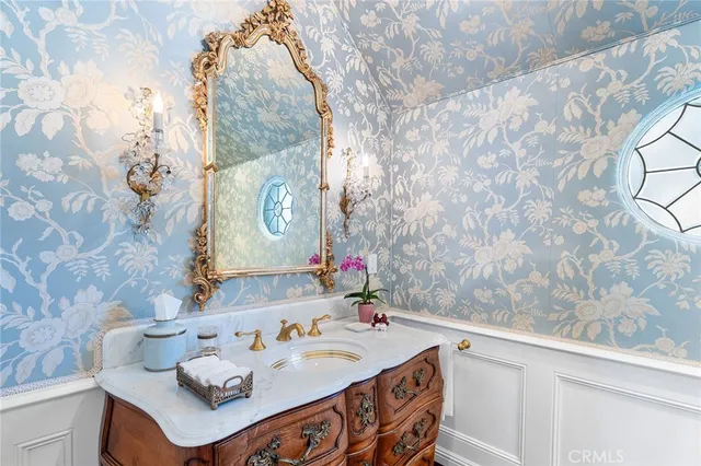 a kitchen with a stove and white cabinets