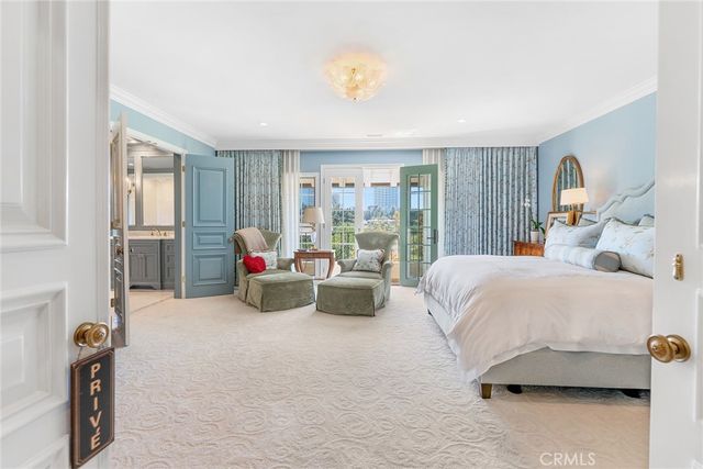 a bathroom with a granite countertop sink mirror vanity bathtub and a toilet