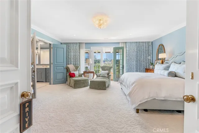 a bathroom with a granite countertop sink mirror vanity bathtub and a toilet