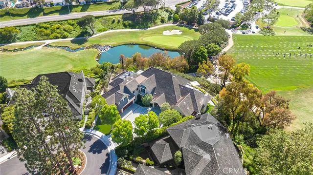 a living room with furniture fireplace and large windows