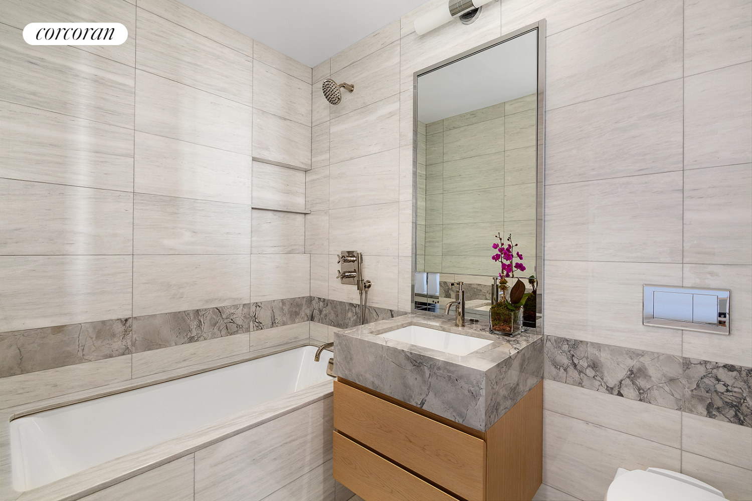 60 East 86th Street, Unit 16 Manhattan, NY 10028 - Photo 6 of 12 a bathroom with a sink and a mirror