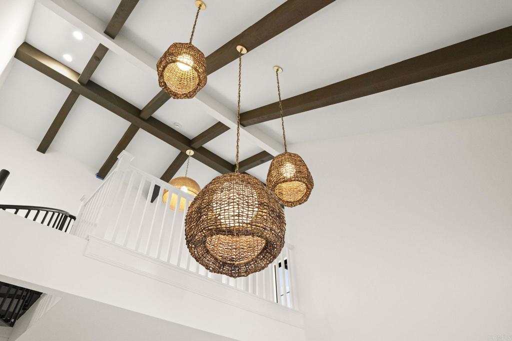 1303 Bergamo, Unit 201 Encinitas, CA 92024 - Photo 25 of 42 a view of a hallway with windows
