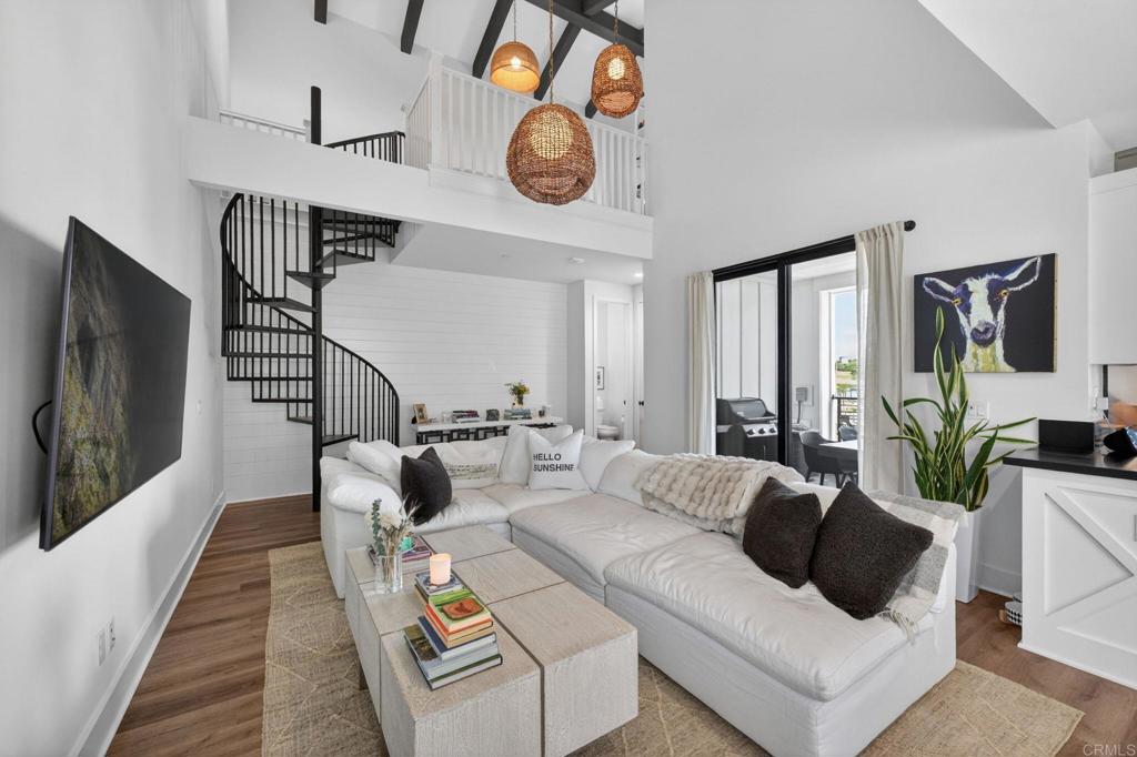 1303 Bergamo, Unit 201 Encinitas, CA 92024 - Photo 27 of 42 a living room with furniture and a flat screen tv