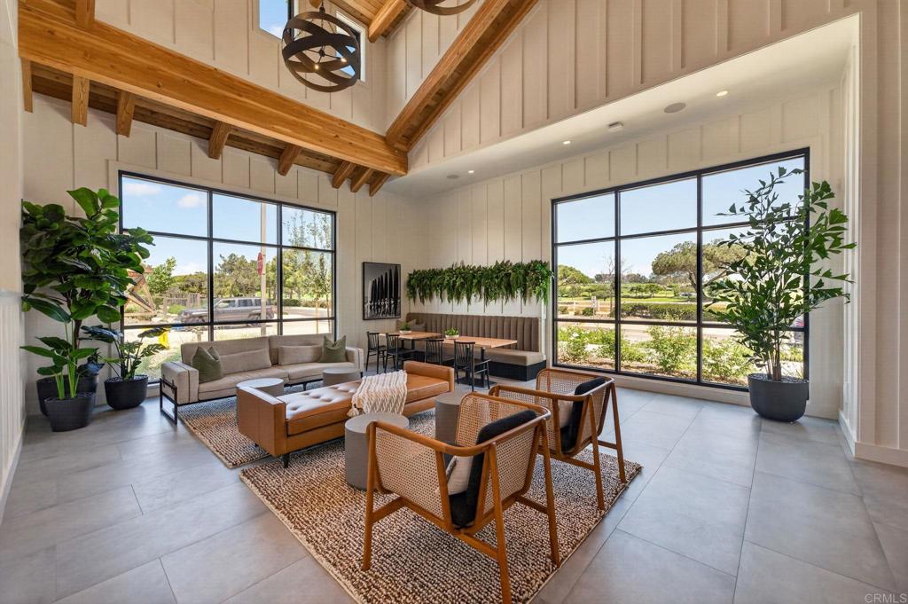 1303 Bergamo, Unit 201 Encinitas, CA 92024 - Photo 36 of 42 a living room with furniture and a floor to ceiling window