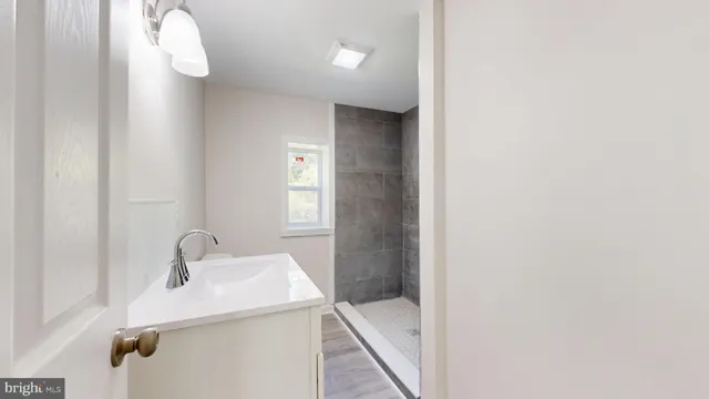 a bathroom with a sink and mirror