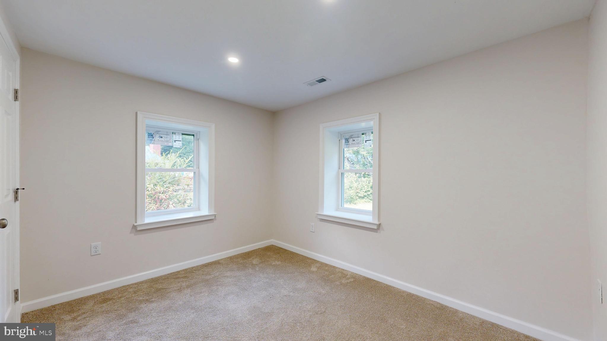 4640 Mahan Corner Road Marydel, DE 19964 - Photo 17 of 29 an empty room with windows