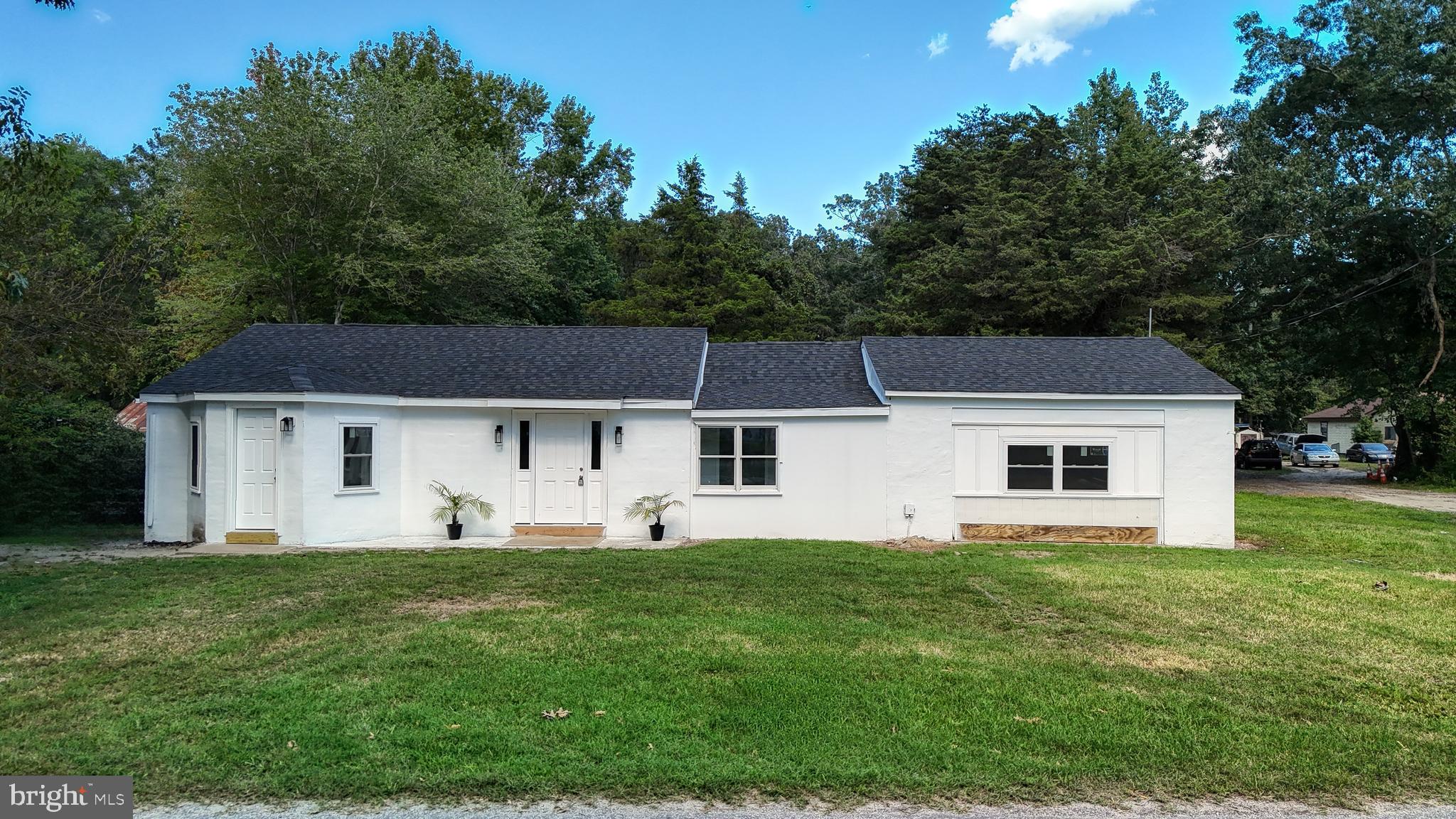 4640 Mahan Corner Road Marydel, DE 19964 - Photo 2 of 29 a front view of house with yard and trees in the background
