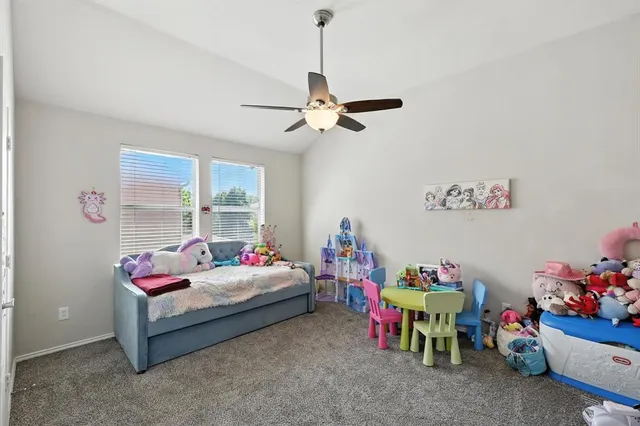 a bedroom with bed and a window