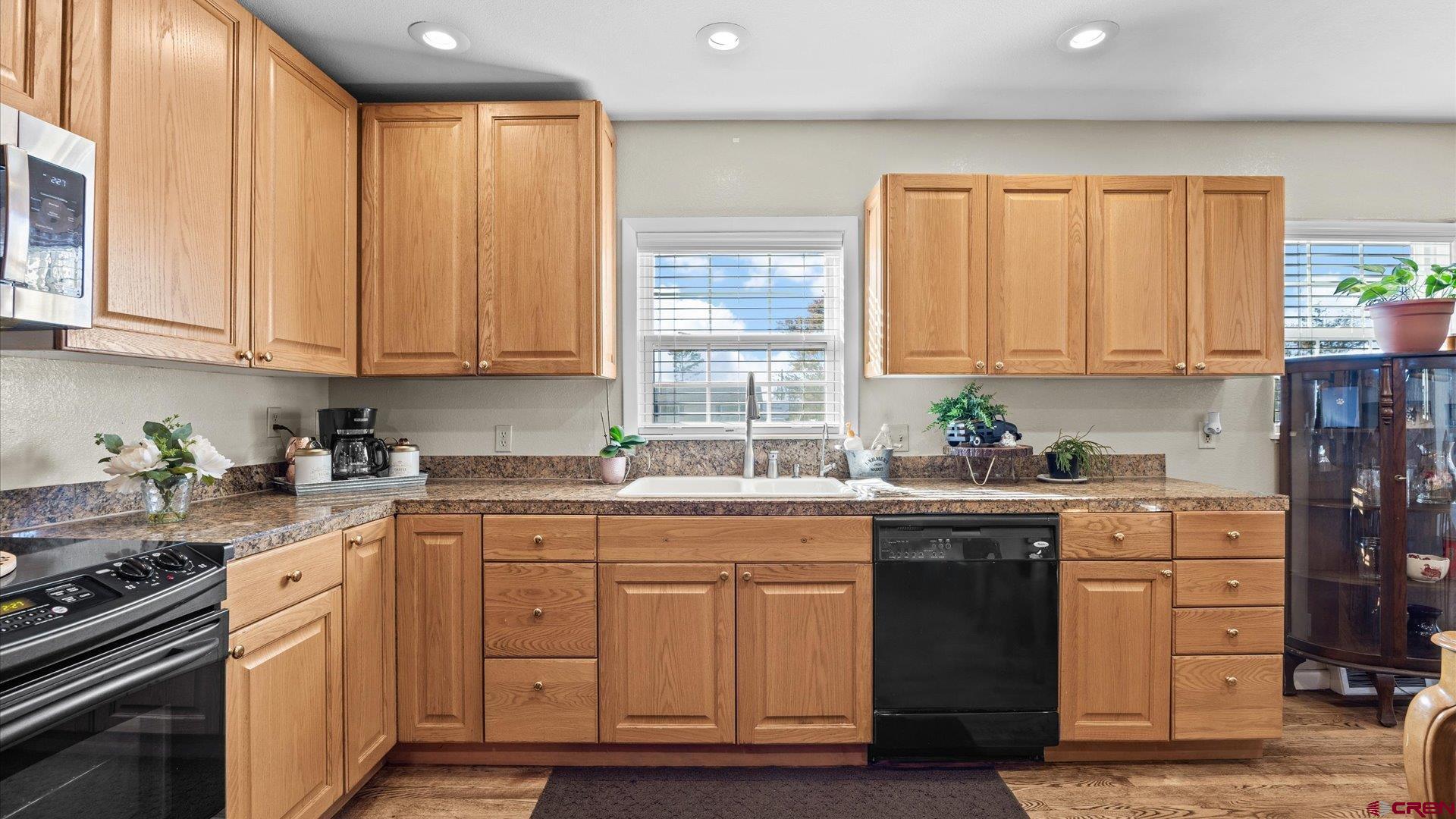 522 Leon Street Delta, CO 81416 - Photo 1 of 31 a kitchen with granite countertop a sink stainless steel appliances and cabinets