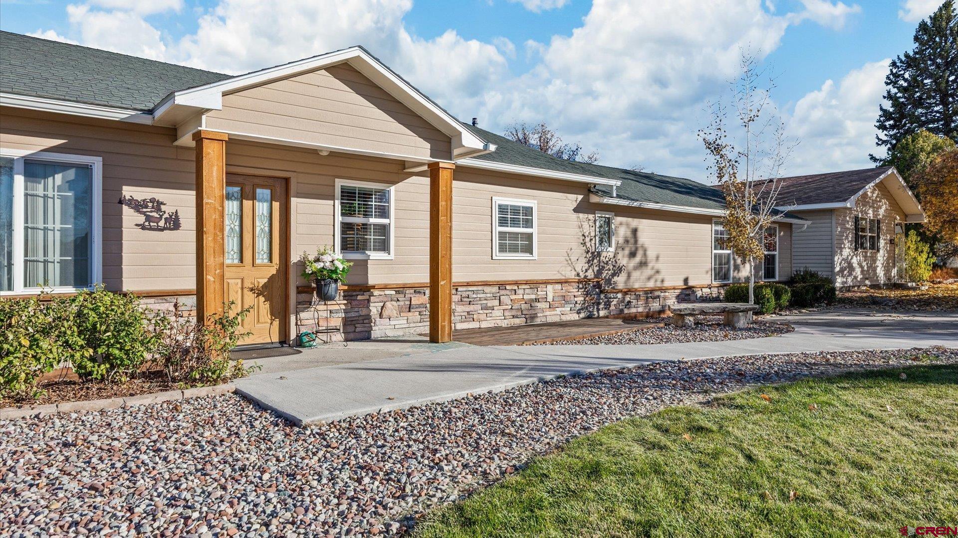 522 Leon Street Delta, CO 81416 - Photo 11 of 31 a front view of a house with garden