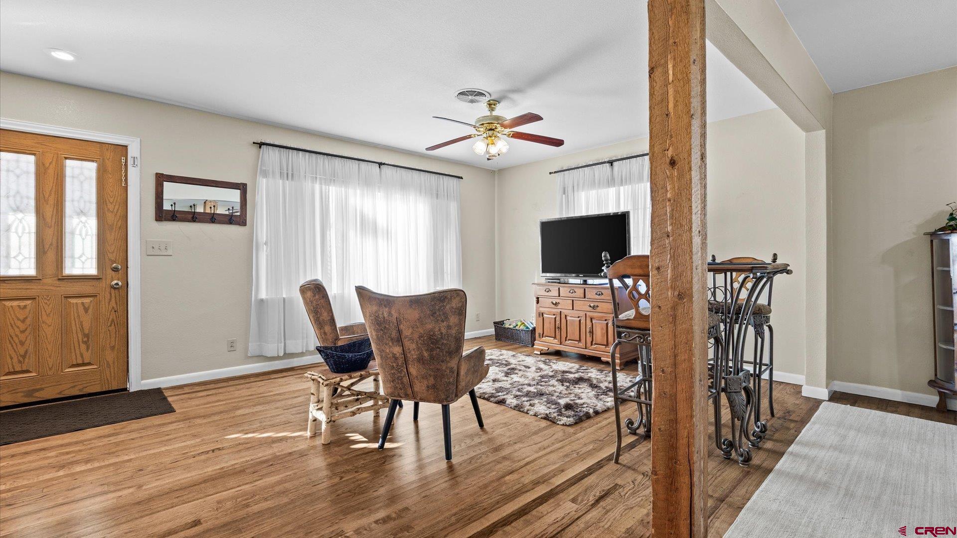 522 Leon Street Delta, CO 81416 - Photo 12 of 31 a view of a dining room with furniture window and wooden floor