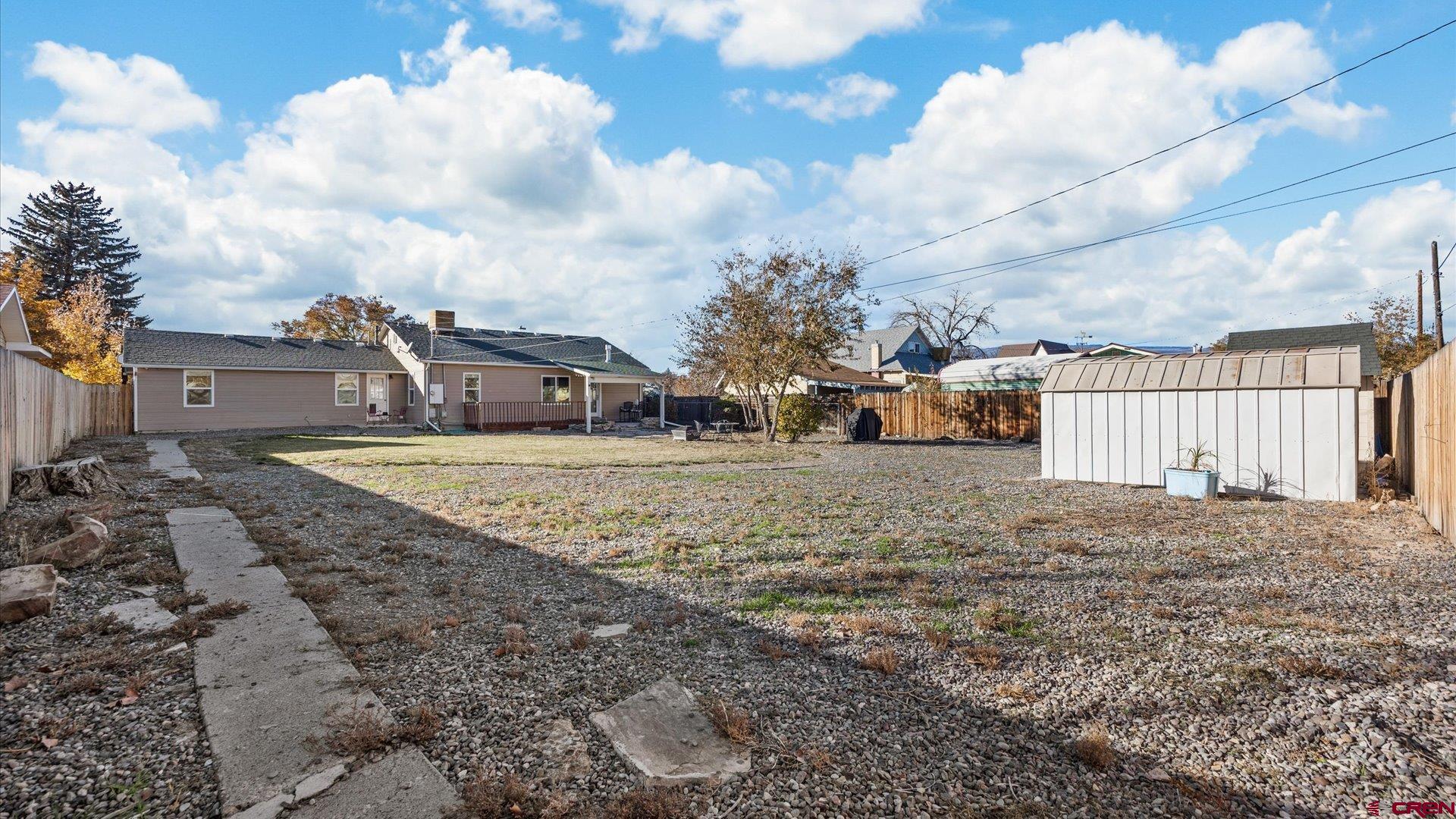 522 Leon Street Delta, CO 81416 - Photo 13 of 33 a view of a house with a yard