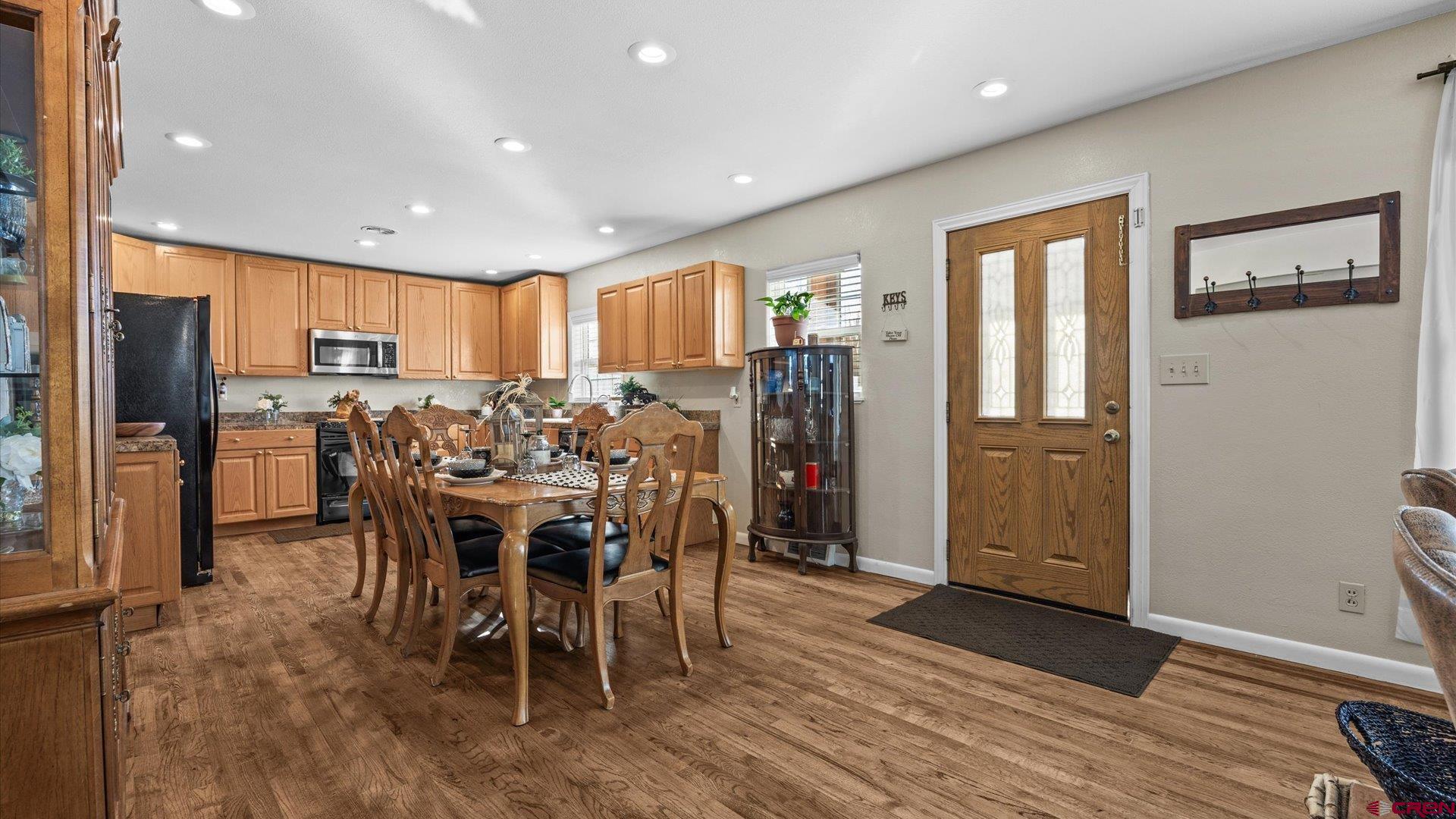 522 Leon Street Delta, CO 81416 - Photo 17 of 31 a view of a dining room with furniture window and wooden floor