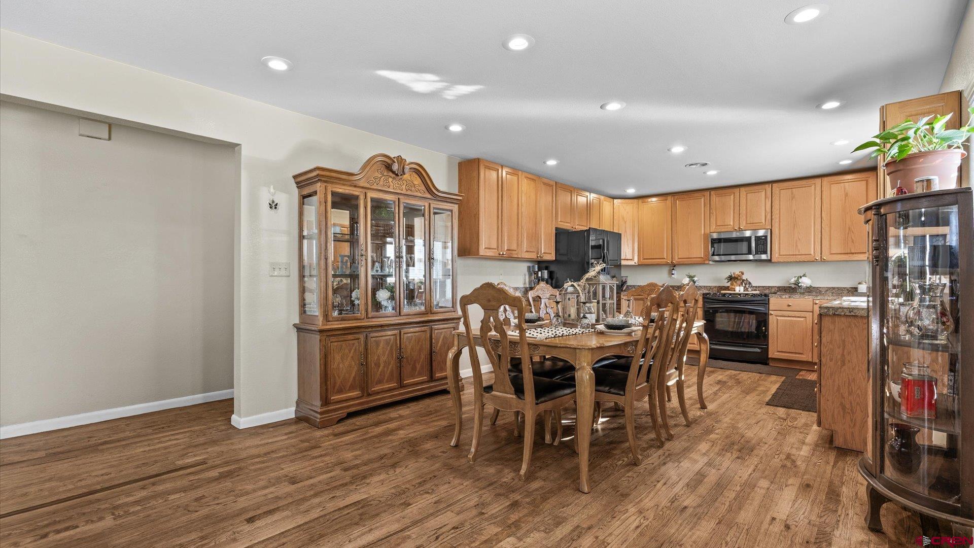 522 Leon Street Delta, CO 81416 - Photo 19 of 33 a view of a dining room with furniture kitchen and wooden floor