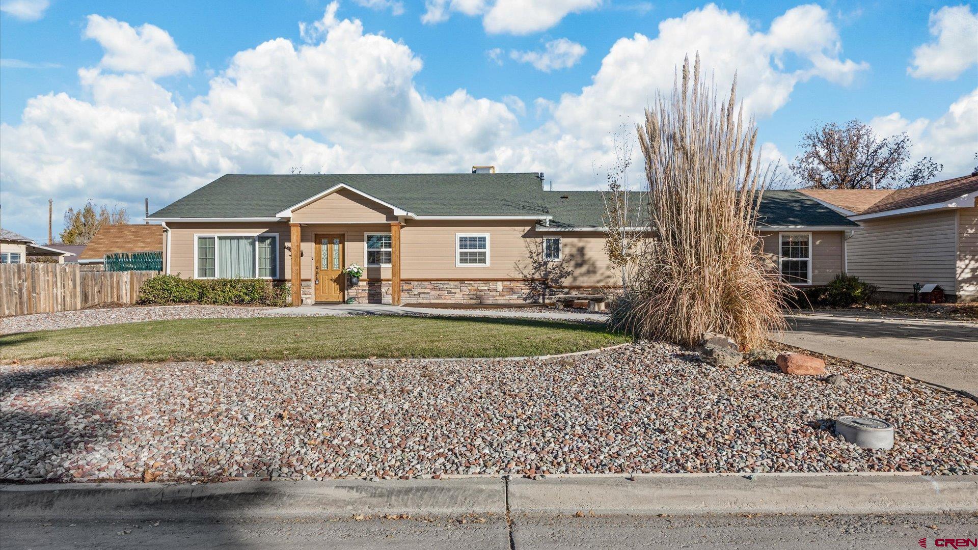 522 Leon Street Delta, CO 81416 - Photo 27 of 33 a front view of a house with a garden