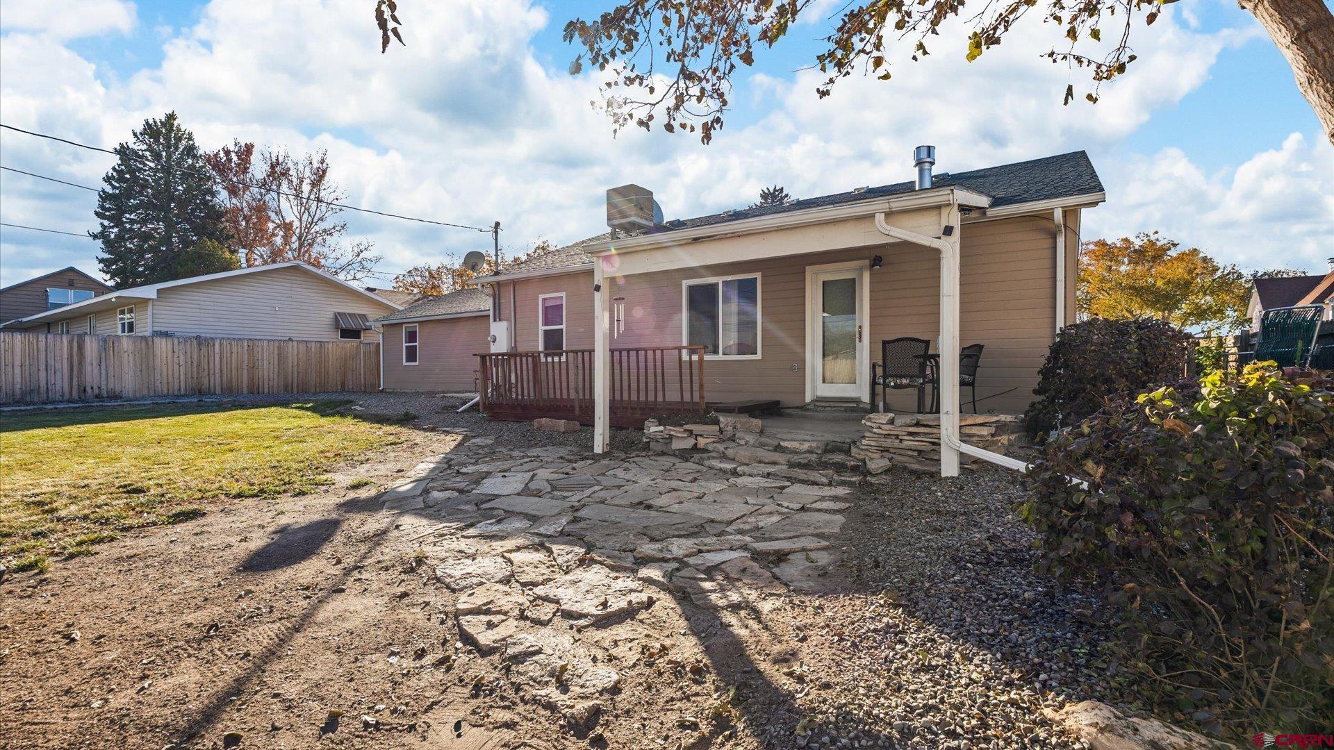 522 Leon Street Delta, CO 81416 - Photo 28 of 31 a view of a house with a yard
