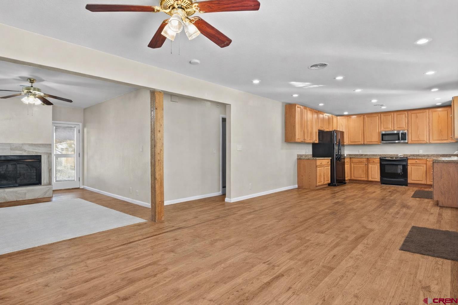 522 Leon Street Delta, CO 81416 - Photo 4 of 33 a view of a kitchen with a sink and a refrigerator