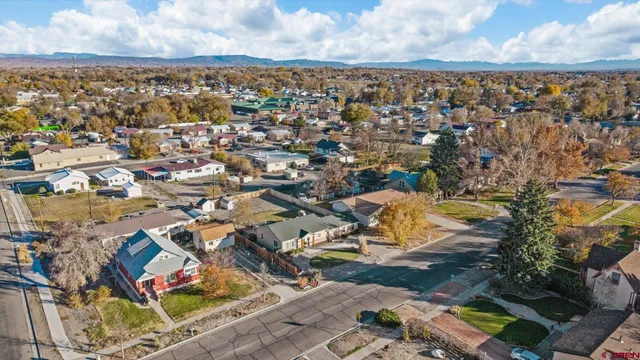 an aerial view of residential houses with outdoor space