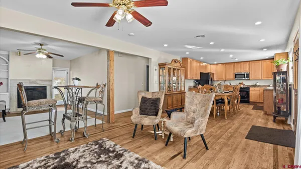 a kitchen with granite countertop a sink stainless steel appliances and cabinets