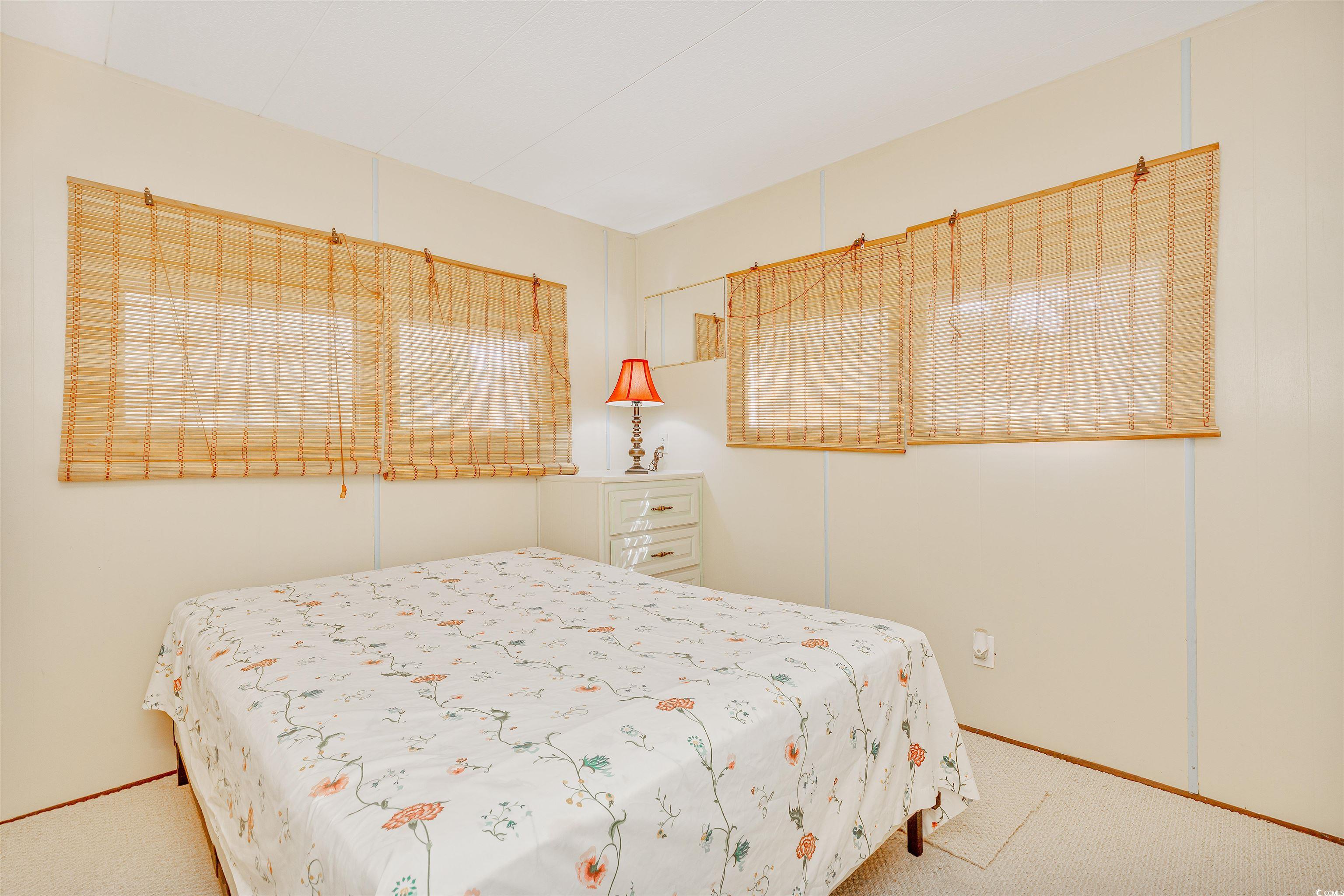 413 Delton Drive Murrells Inlet, SC 29576 - Photo 19 of 34 Carpeted bedroom featuring baseboards