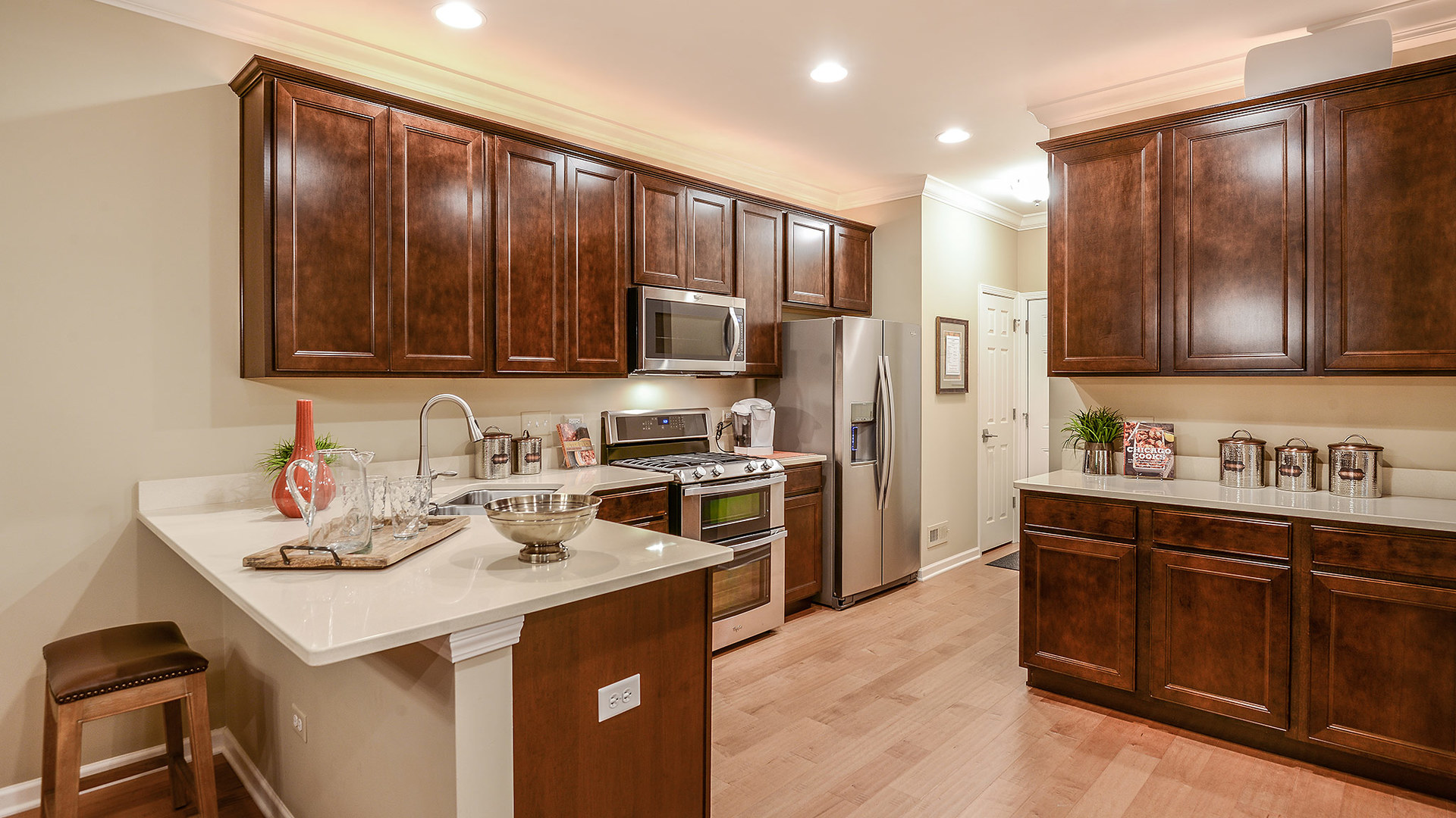 2057 Stuttle Road Batavia, IL 60510 - Photo 10 of 22 a kitchen with kitchen island granite countertop a sink stove and refrigerator