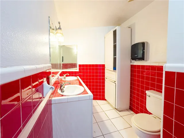 a bathroom with a toilet and shower