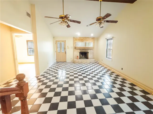 a view of a livingroom with a black and white checkered floor