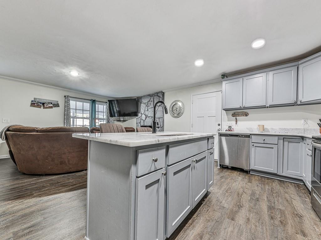 87 Jones Street Jasper, GA 30143 - Photo 5 of 25 a kitchen with counter top space sink and cabinets