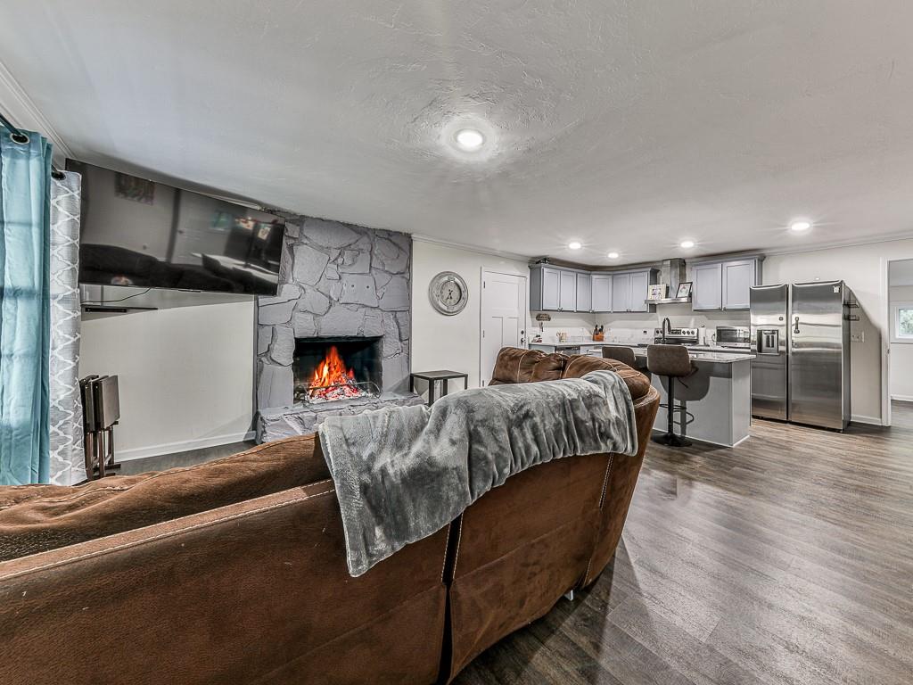 87 Jones Street Jasper, GA 30143 - Photo 7 of 25 a living room with furniture and a wooden floor