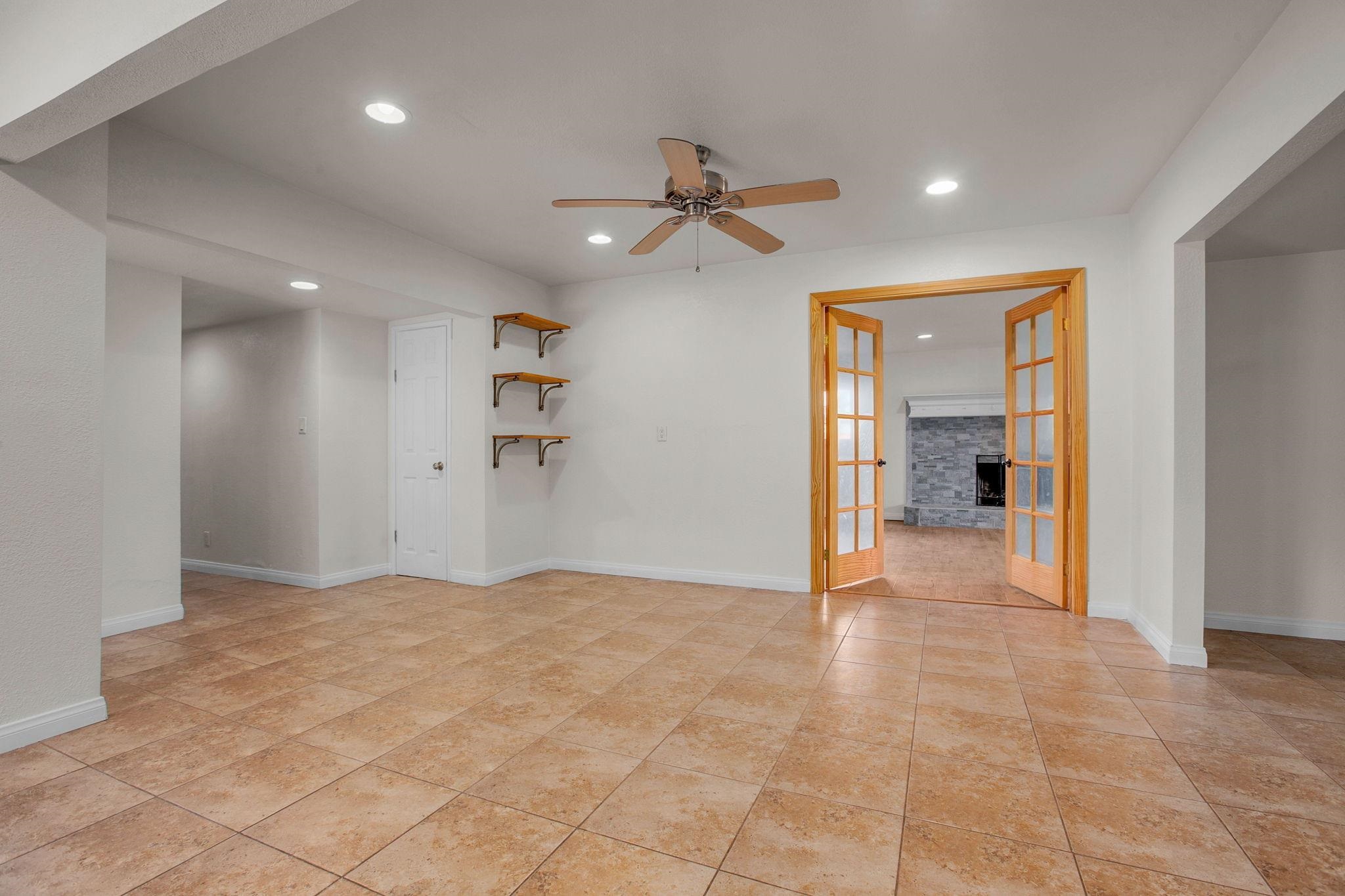 209 Casper Lane Vista, CA 92084 - Photo 11 of 12 en view of a livingroom with a chandelier fan and windows