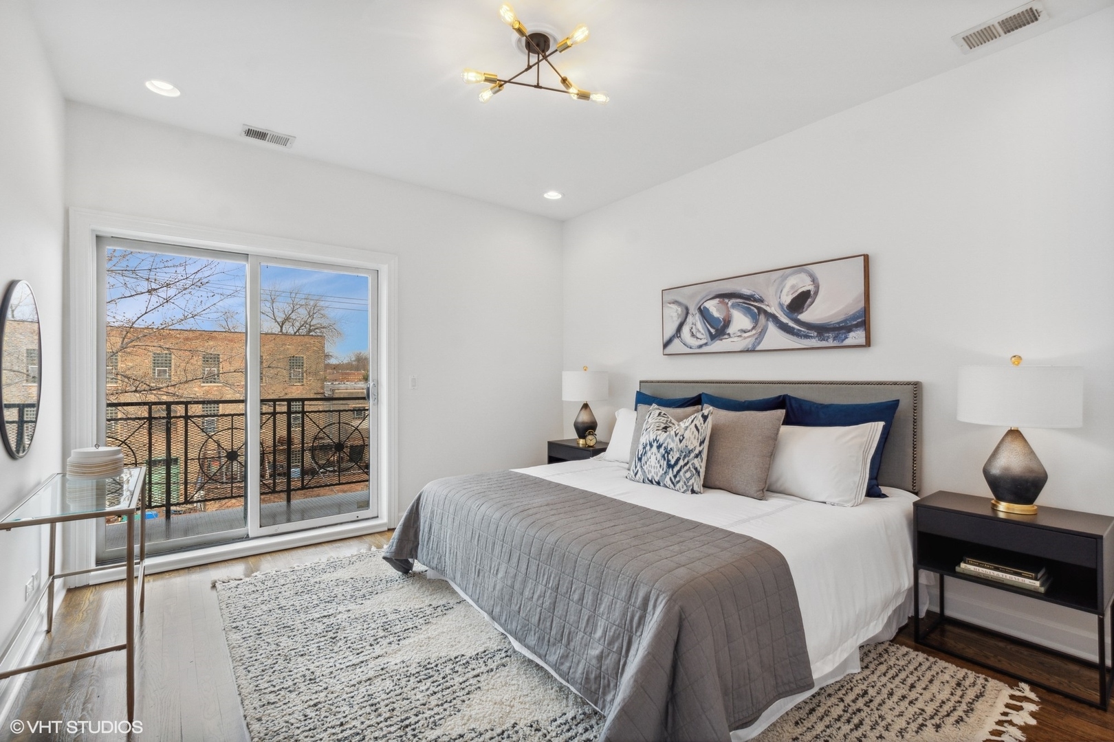 2130 West Rice Street, Unit 3 Chicago, IL 60622 - Photo 11 of 18 a bedroom with a large bed and a window