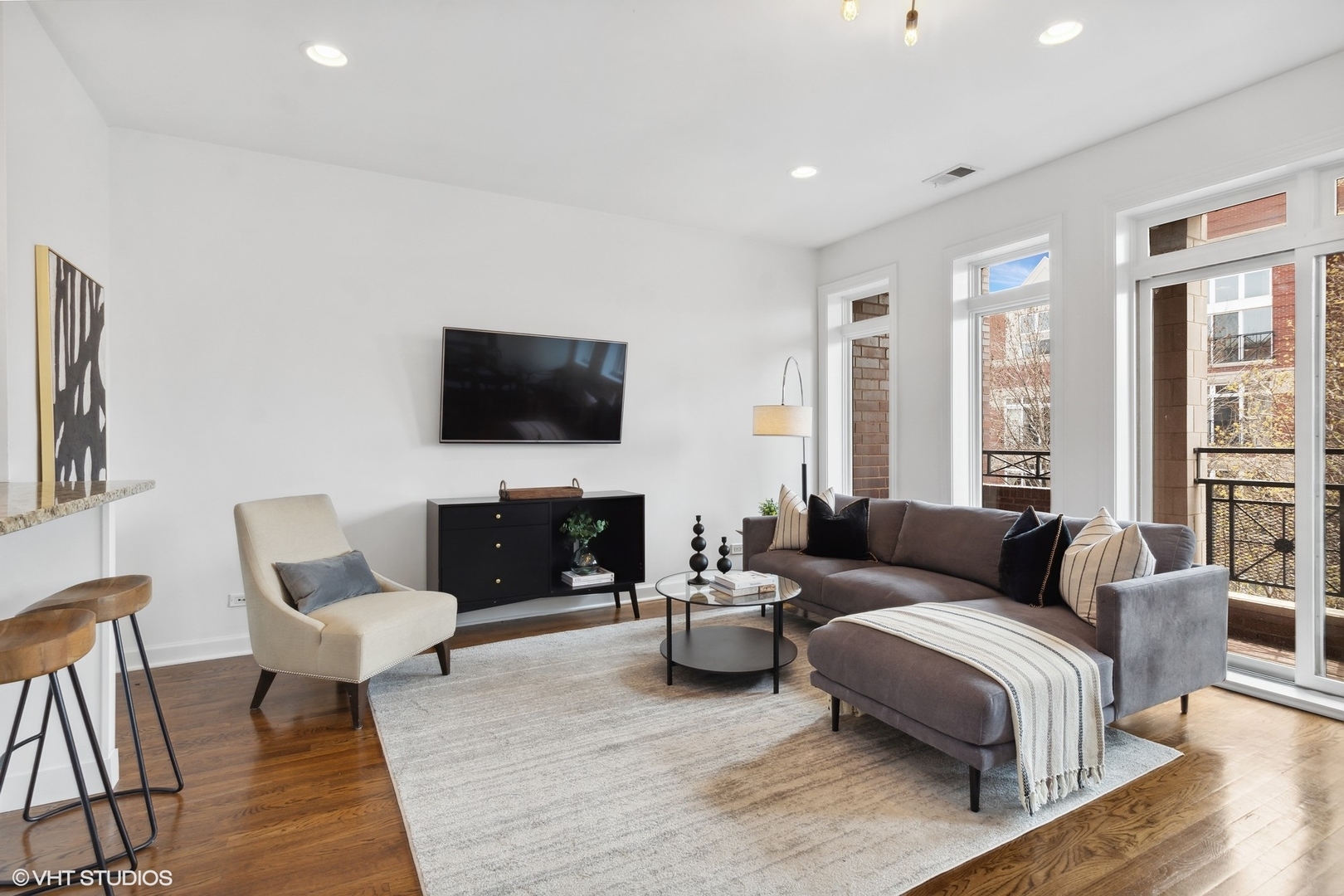 2130 West Rice Street, Unit 3 Chicago, IL 60622 - Photo 2 of 18 a living room with furniture a fireplace and a flat screen tv