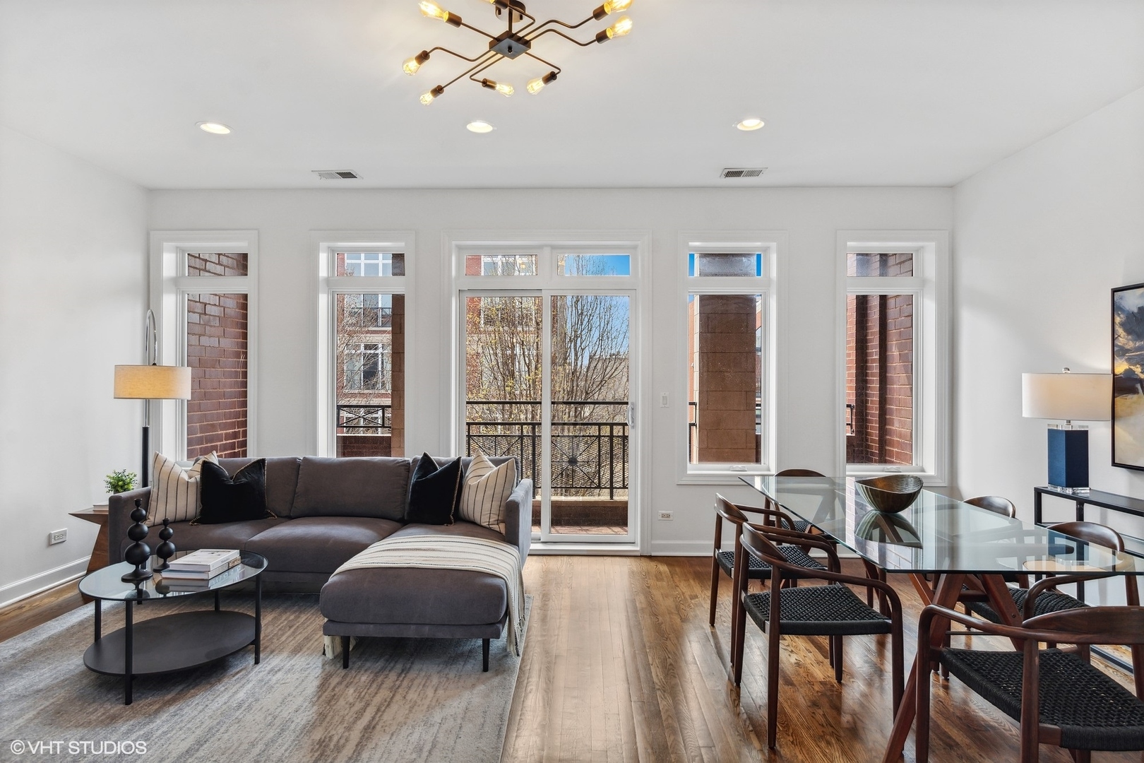 2130 West Rice Street, Unit 3 Chicago, IL 60622 - Photo 3 of 18 a living room with furniture and floor to ceiling windows