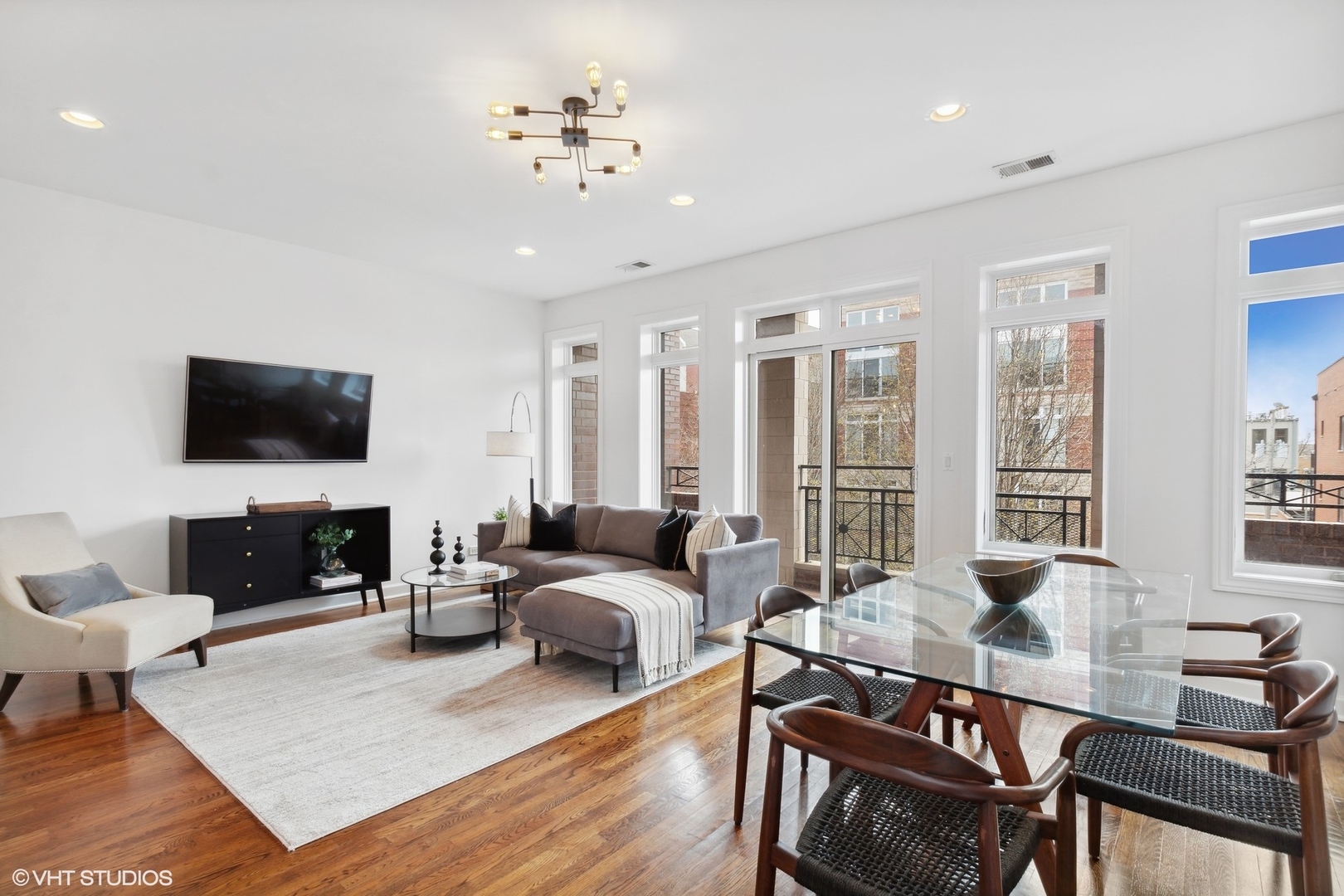 2130 West Rice Street, Unit 3 Chicago, IL 60622 - Photo 8 of 18 a living room with fireplace furniture and a flat screen tv