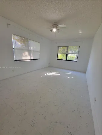 a bathroom with a toilet and a tub
