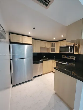 an empty room with windows and wall painting