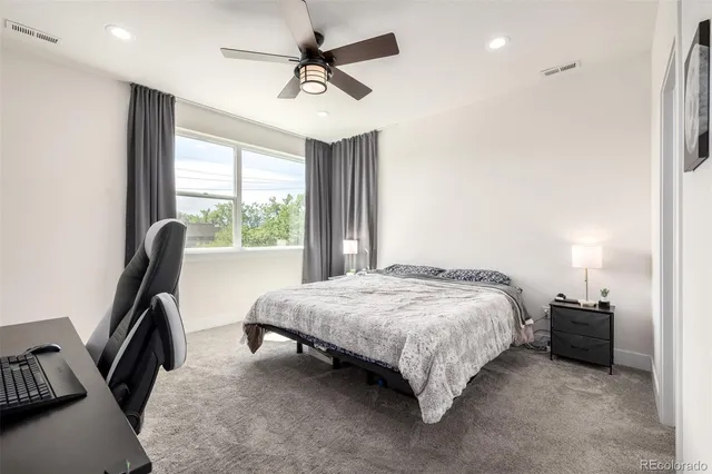 a bedroom with a bed closet and a window