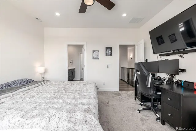 a bedroom with a workspace